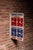 Double-sided painted metal shop sign featuring bold "WE'RE OPEN" header in blue with contrasting red "WEEKDAYS" and blue...