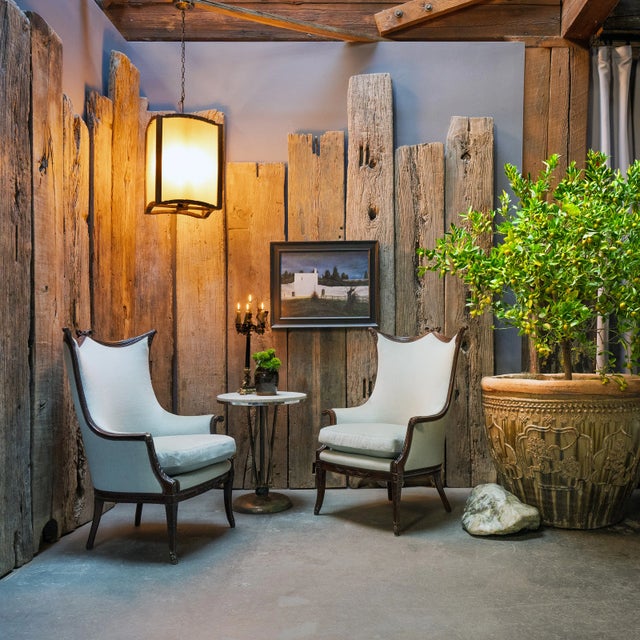 Framed in northern elmwood, this elegant lantern casts a soft glow through frosted glass. Exemplifying the refined...