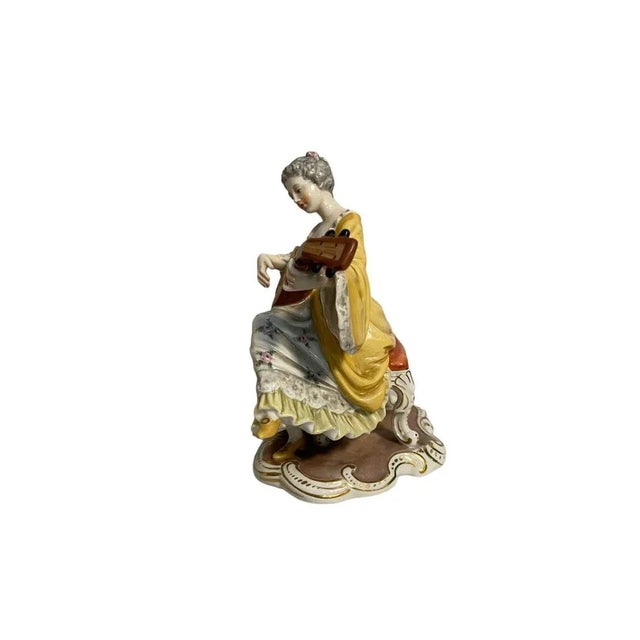 Ceramic figurine, Lady Playing Guitar, late 19th century, Capodimonte Ginori Refined hand-decorated ceramic figurine...