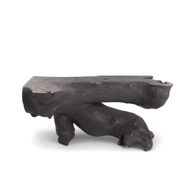 Inspired by the beauty of natural wood form, this organic console table is handcrafted from one piece of salvaged wood....