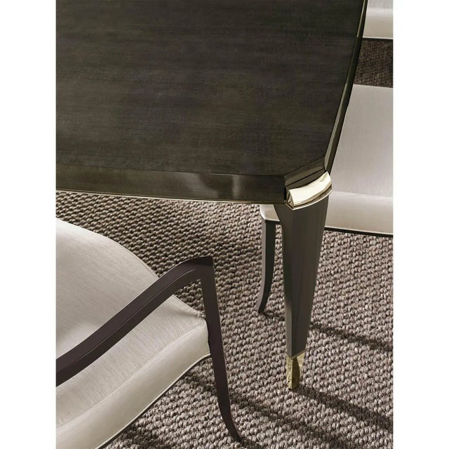 An Art Deco-style dining table that is perfect for intimate dinner parties or large family gatherings. This beautiful...