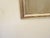 This silverleafed mirror has an old rubbed patina and measures 31.75"H x 20.5"W.