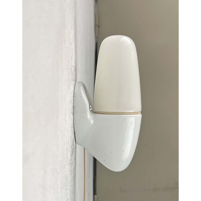 Classic wall lamp by Lindner, designed by Wilhelm Wagenfeld in the 1950s. The 6065 is a functional, elegant, and therefore...