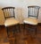 A handsome pair of hand carved, mid-Victorian side chairs in ebonized wood with original period striped upholstery and...
