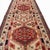 This antique runner, approximately 100 years old, features a distinctive medallion design inspired by the geometric...