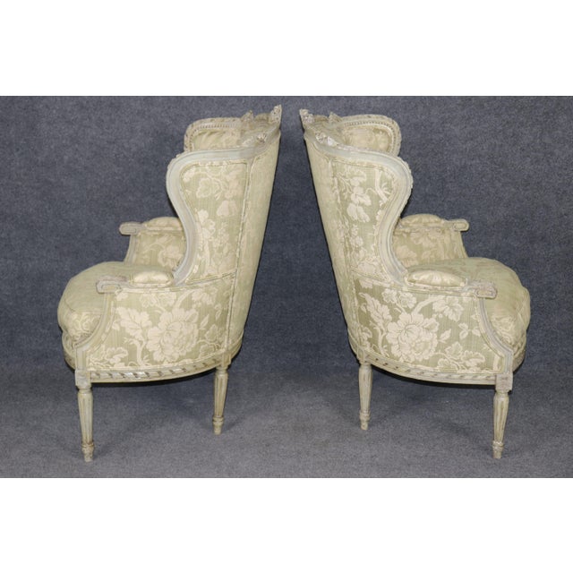 Dimensions: 41.75 inches (high) x 28 inches (wide) x 27.5 inches (deep). Seat Height 19.5 inches A charming pair of early...