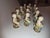 Beautiful little capodimonte ceramic figural place card holders..set of twelve.