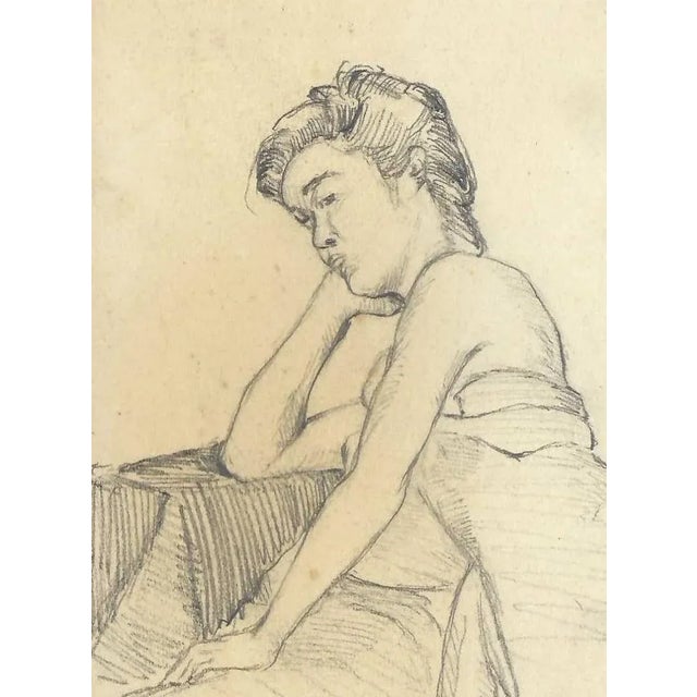 Drawing of a woman by a Japanese artist. Some pages in the sketchbook are signed by the artist Shirosu and dated. This one...