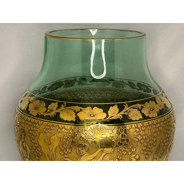 Very Large Moser Vaseline/Uranium Green Glass Vase Decorated with Gilt Greco-Roman Frieze for your consideration. The vase...