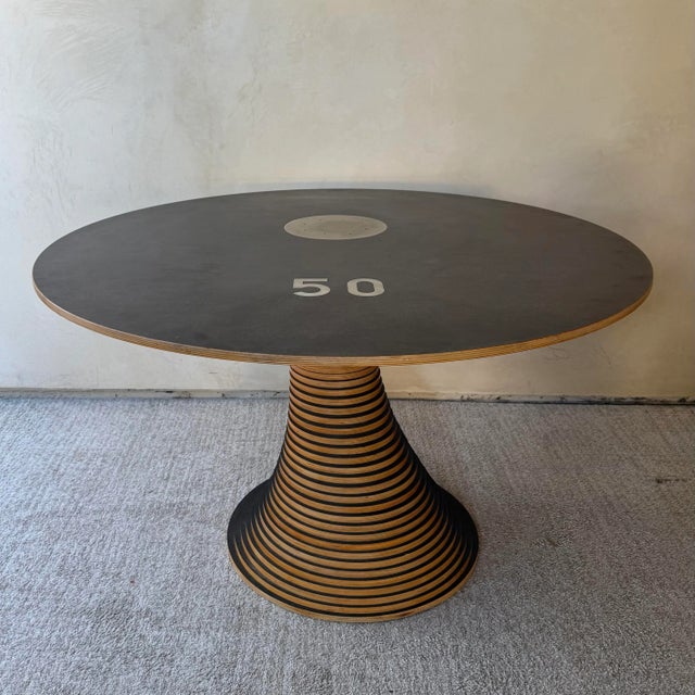 Marcello Pozzi for Restoration Hardware Stack 50 Dining Table, Made in Italy 50 plywood disks stacked on a metal rod....