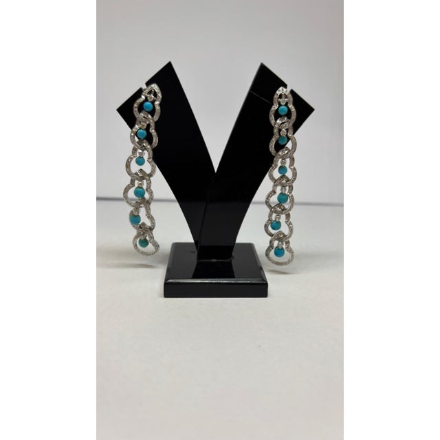 Gemstone details Diamond weight: 1.86 cts Turquoise weight: 2.47 cts 14K gold Gross weight: 14.74 grams Gold weight: 13.87...