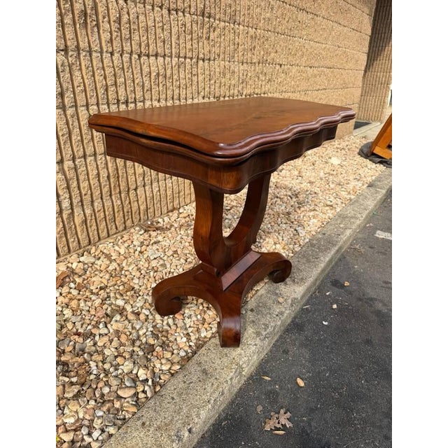 Antique Flame Mahogany Folding Top Empire Style Card Table Console Table. Circa late 19th century to early 20th century A...