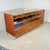 Beautifully crafted counter from the 1960s. The frame is made of solid oak and stands on six gold-colored steel legs with...