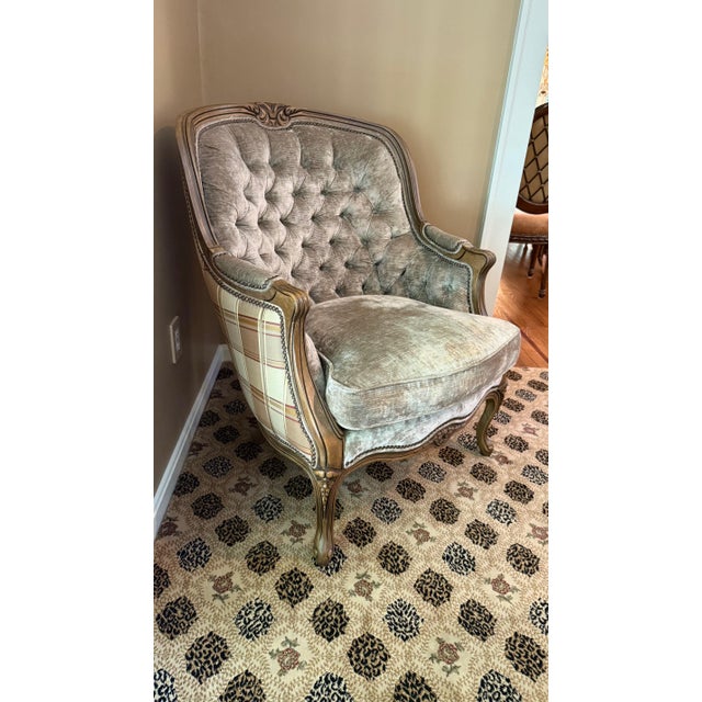 A beautifully crafted Bergère armchair in the Louis XV style, attributed to Hancock & Moore, known for their superb...