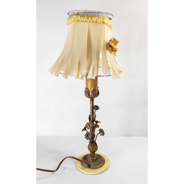 We are selling this great looking small boudoir table lamp. This table lamp has Italian toleware type base with floral...