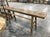 A substantial antique primitive wood mortise workbench with a beautifully worn surface and rich, layered patina developed...