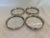 Set of 4 sterling silver rimmed glass coasters. The sterling rims are pierced with a unique pattern and the bottom of each...