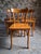 Set of six French bistro chairs made by Baumann in the 1950s. The chairs are made from beechwood and feature gently curved...