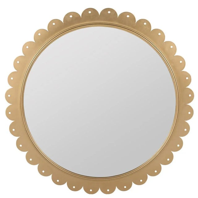 Say hello to our Candler Mirror. Sweet like a Georgia peach, this Atlanta-inspired piece features a soft scalloped brass...