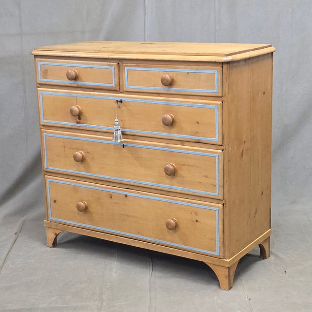 An absolutely charming antique early 1900s English Edwardian rustic natural pine chest of drawers dresser with a blue...