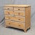 An absolutely charming antique early 1900s English Edwardian rustic natural pine chest of drawers dresser with a blue...
