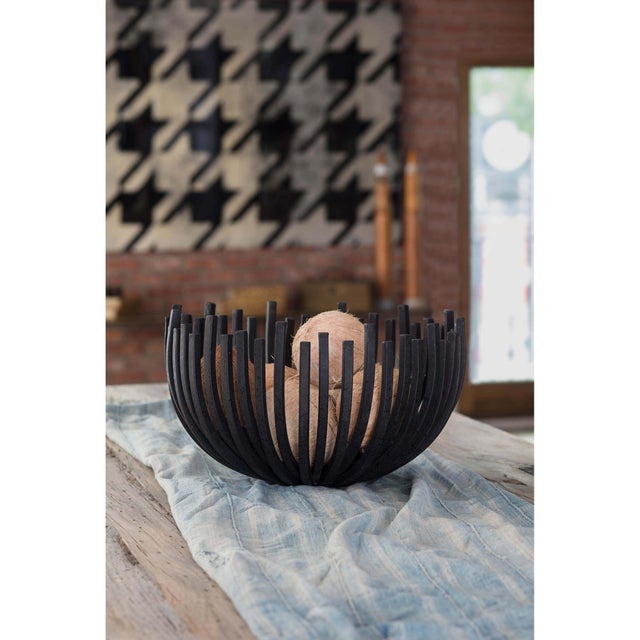 This sculpted webbed bowl finished in the enduring blackened iron seamlessly merges form and function. With it's sculpted...