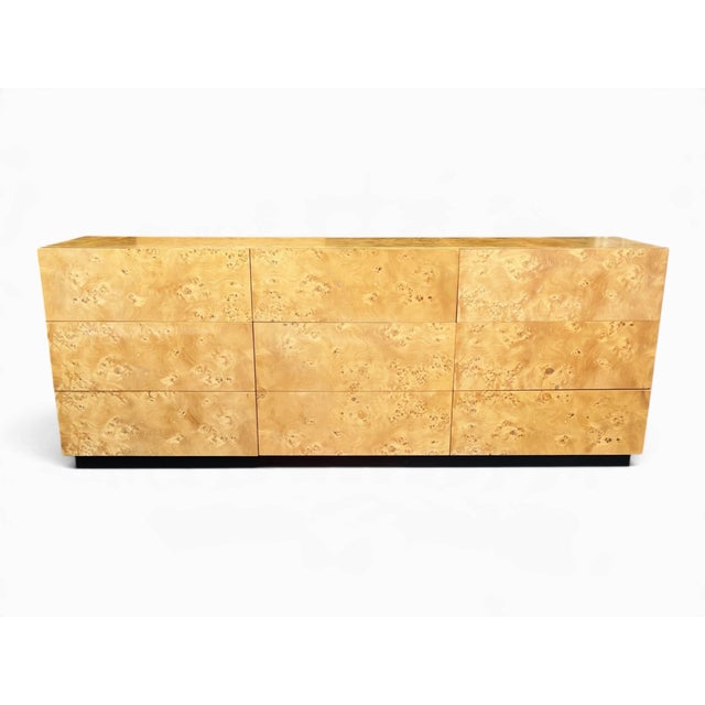 This vintage burl wood dresser combines richly patterned wood with a clean, balanced silhouette. Swirling grain and...