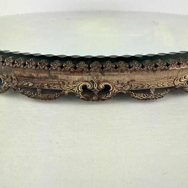 This beautiful vintage mirrored plateau dates from the early 1900's, a period when ornate plateaus were commonly used as...
