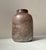 Almost looking like a piece of Roman Ancient glass this unusual vase was made in France circa 1880-1920 anonymously. It...