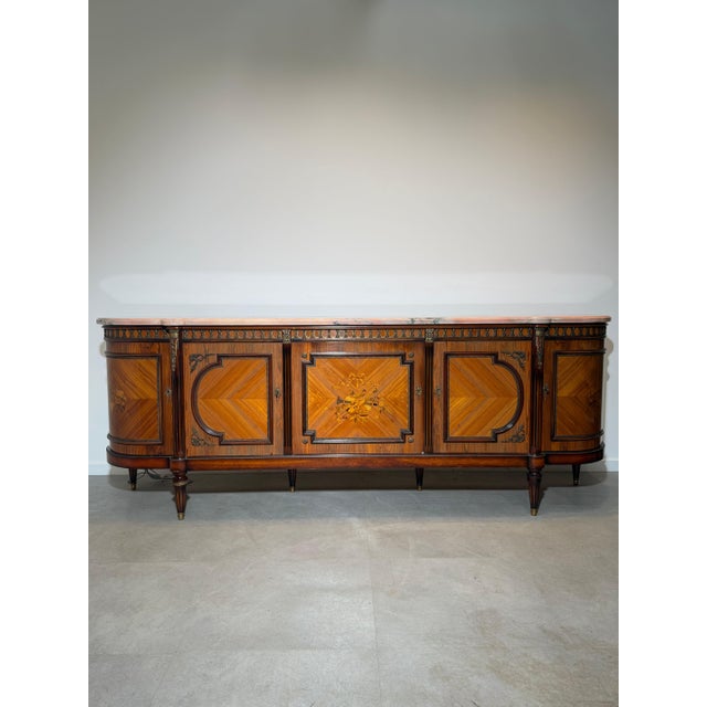 Elegant and exceptionally crafted louis xvi style sideboard by renowned belgian cabinetmaker jp ehalt. This impressive...