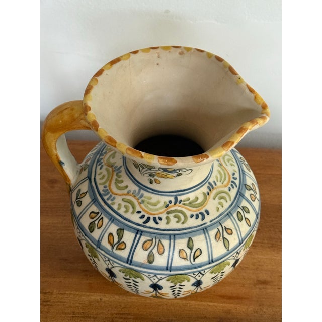 Lovely Midcentury Spanish pottery jug pitcher in traditional colors of blue, green, and goldenrod. Please see condition...