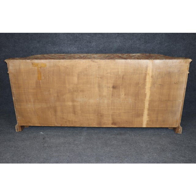 An extraordinary and exceptionally rare Italian Rococo sideboard dating from the early twentieth century, this magnificent...