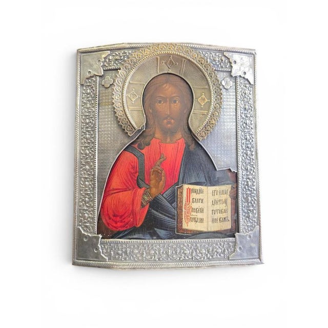 Exceptional 19th-century Russian icon depicting Christ Pantocrator, adorned with a finely crafted silvered metal oklad...