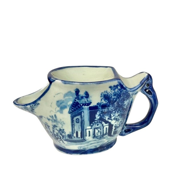 A classic antique English shaving mug made of Victoria Ware flow blue ironstone. This beautiful transferware piece...
