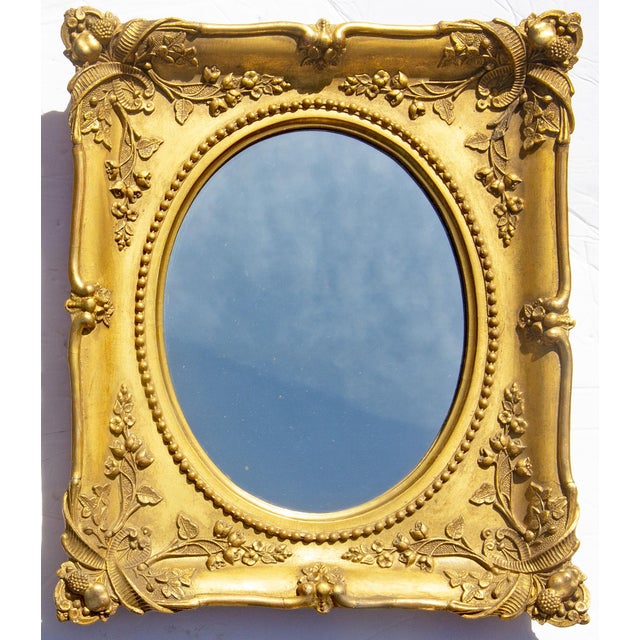Pair gilt carved wood and gesso mirrors. Continental. Mid 19th Century. Beautiful original gold gilding.