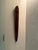 a striking elongated wooden wall sculpture sourced from Material Possessions in Chicagoland, known for their curated mix...