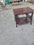 Elegant vintage mahogany two-tier occasional table featuring finely detailed Chippendale-inspired design. The rectangular...