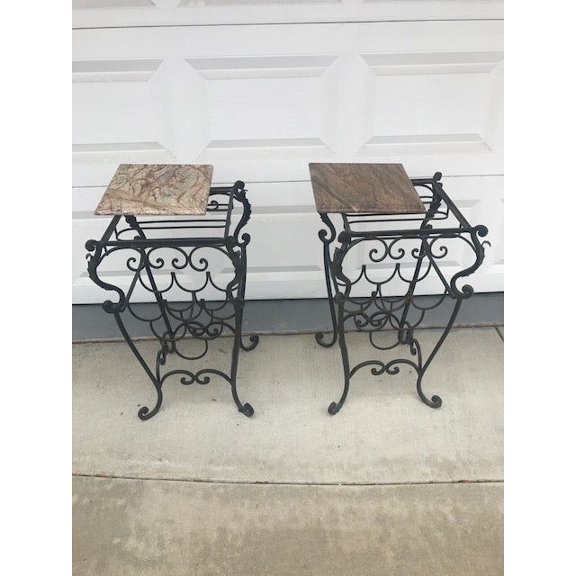 Beautiful European wrought iron wine table with marble tops. Each holds 6 bottles of wine and stemware.