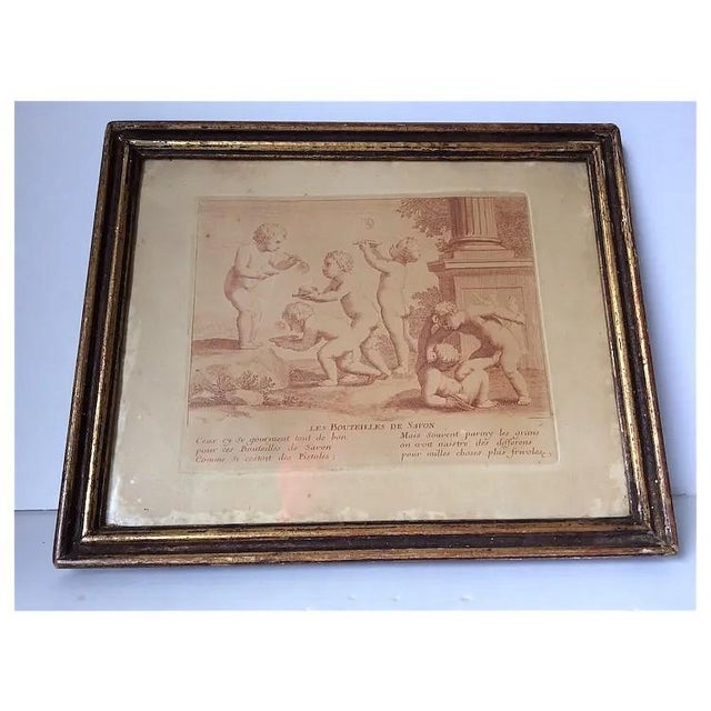 A pair of Antique French Engravings. The prints depict cherub, children playing and are from the series "Les jeux et...