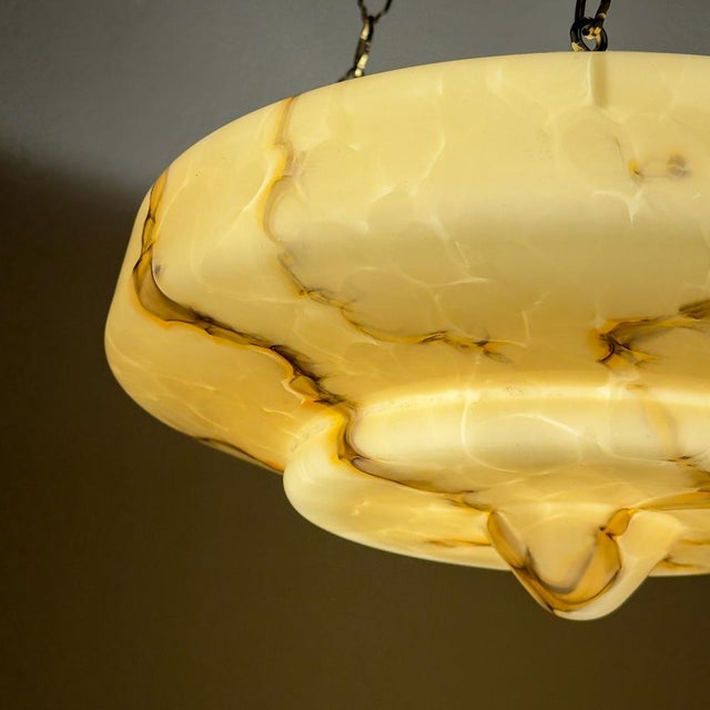 Vintage yellow glass pendant lamp made in italy in the 1930s. the lamp is in good vintage condition, with no damage. The...