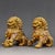 This is a matching pair of vintage guardian lion (often referred to as Foo Dog) statues, crafted from copper with...