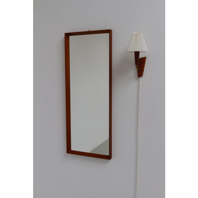 Danish Mid-Century Teak Mirror and Sconce Hallway Set, 1950s. Set of 2. A classic Scandinavian Mid-Century Modern...