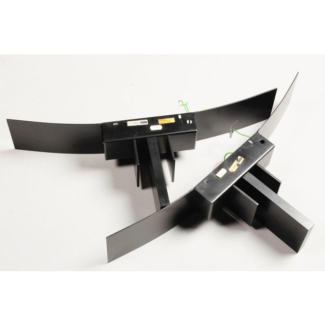 Set of 2 black metal wall lamps made in france in the early 1980s. designed by jean michel wilmotte. made by sce, france...