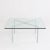Barcelona table, designed by Ludwig Mies van der Rohe. Table top in clear flat glass, and chrome polished base. This piece...