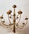 Amazing solid bronze chandelier decorated with tassels, knots and ribbons. Its 12 slender arms with bobeches with beaded...