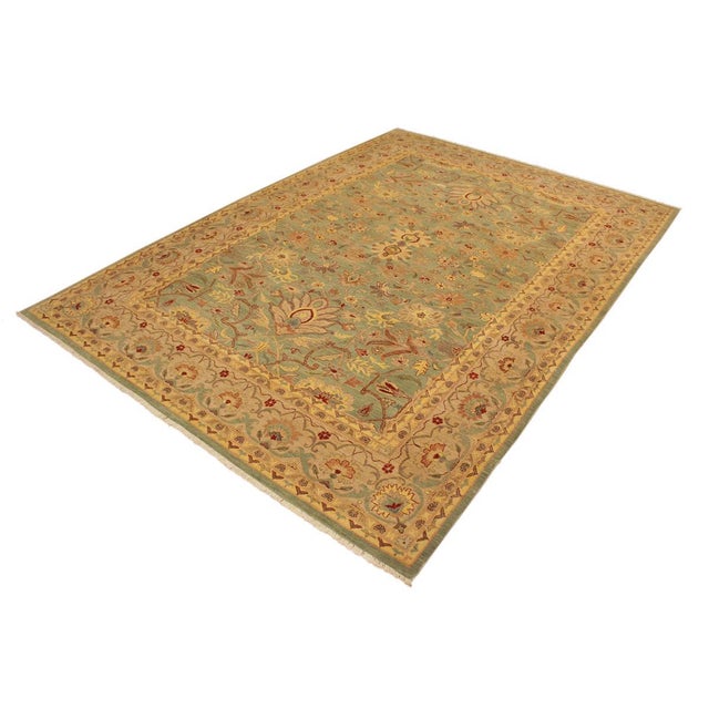 A Persian influenced Turkish hand knotted rug made by skilled artisans capable of creating the most exceptional vegetable...