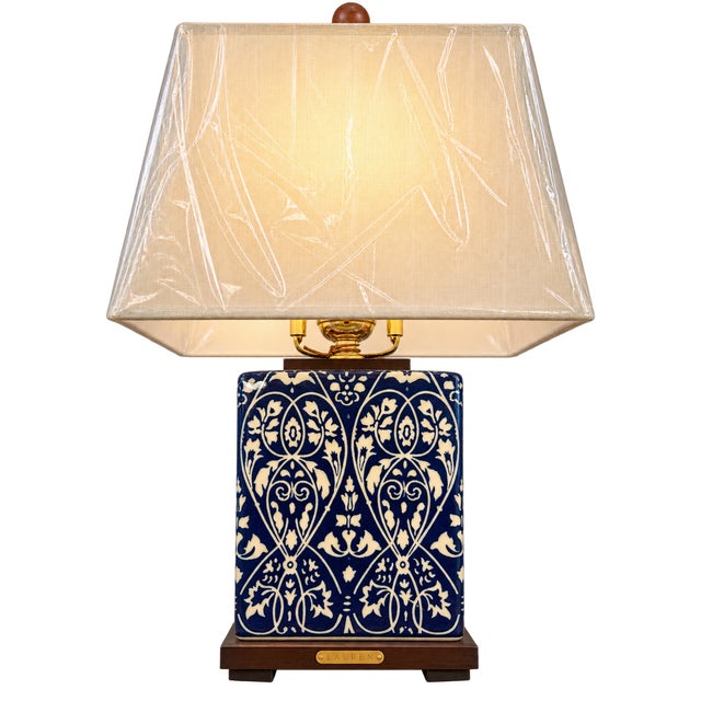A beautiful matching pair of Lauren Ralph Lauren blue and white ceramic table lamps featuring a richly saturated cobalt-...