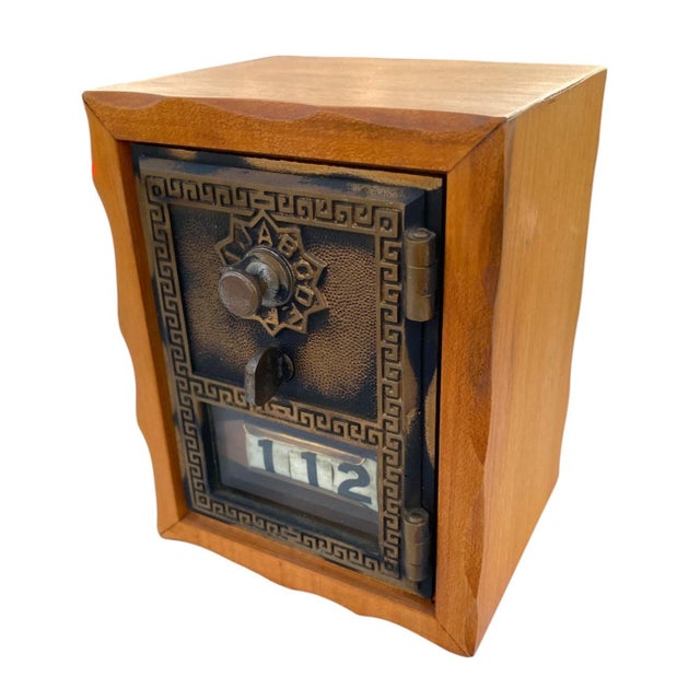 This is an authentic old brass postal door repurposed into a lock box/bank. Working combination lock (code is located on...