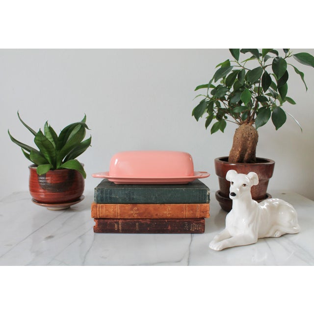 Vintage pink lidded butter dish. Made in the USA by Boonton. Minor age wear.