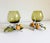 A wonderful pair of mid-20th-century vintage Italian Toleware hurricane candle holders or vases. These feature whimsical,...